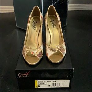 Carlos Santana gold-multi peep toe pumps.